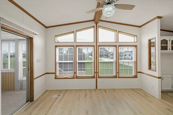 a view of an empty room with a window