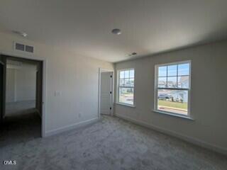 706 Old Station Angier, NC 27501 - Photo 13 of 19 a view of an empty room with windows