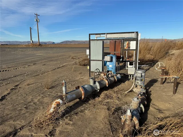 a bed room with a bed and a chair