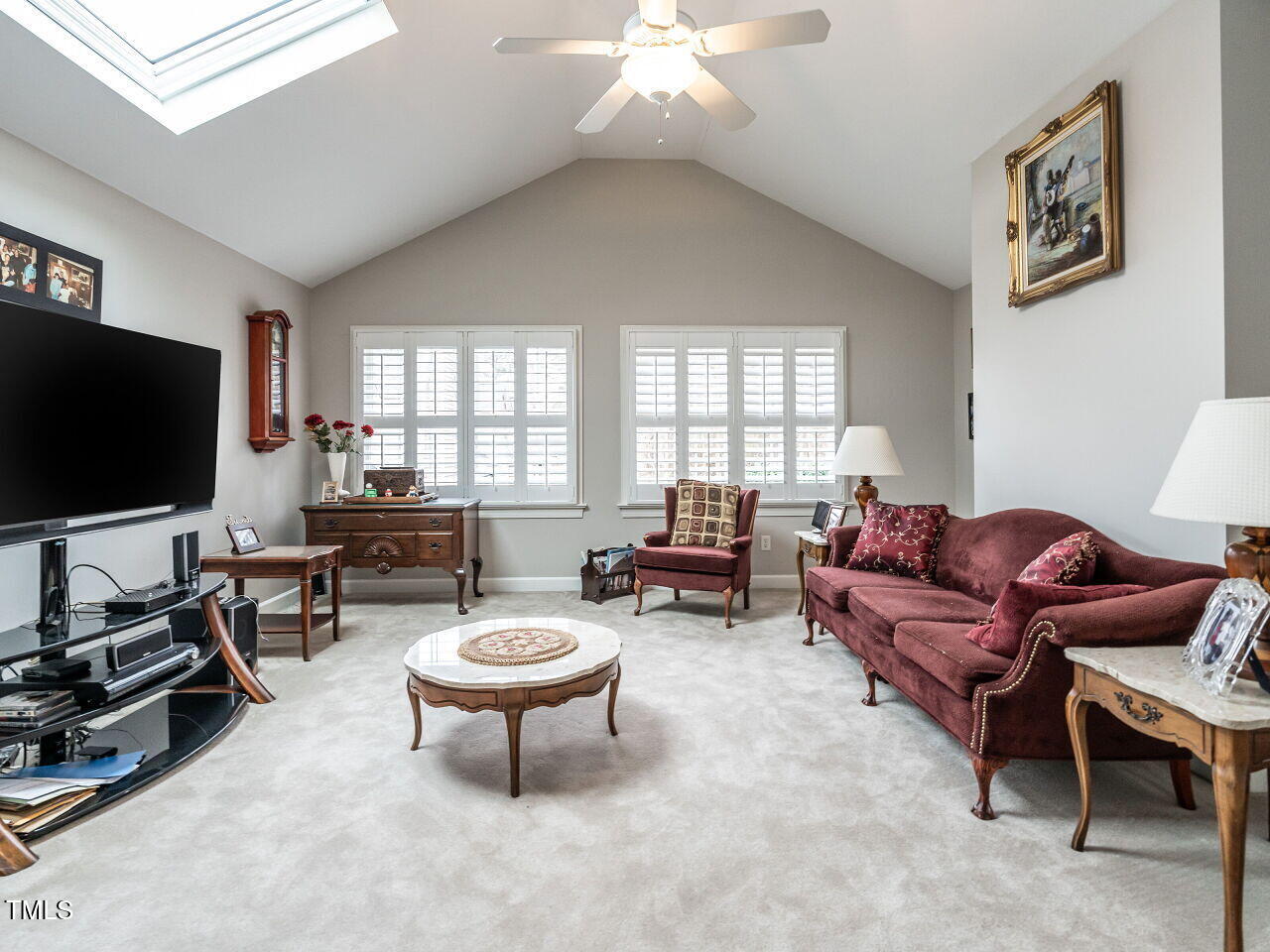 4203 Norman Ridge Lane Raleigh, NC 27613 - Photo 15 of 15 a living room with furniture a flat screen tv and a window