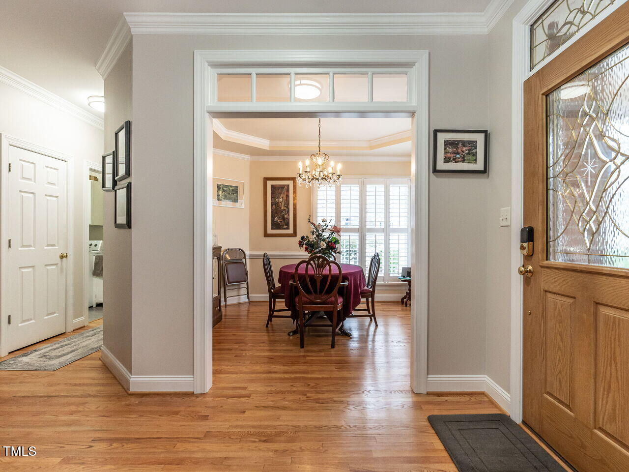 4203 Norman Ridge Lane Raleigh, NC 27613 - Photo 2 of 15 a view of a dining room with furniture window and wooden floor