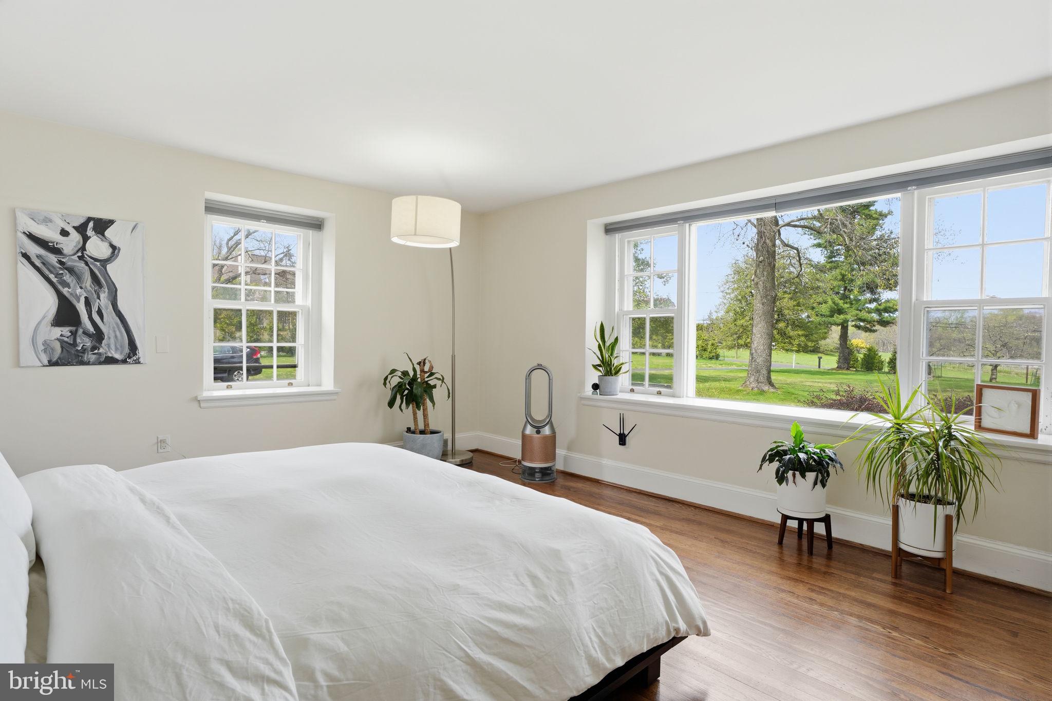 448 Moredon Road Huntingdon Valley, PA 19006 - Photo 18 of 66 a spacious bedroom with a bed and a large window