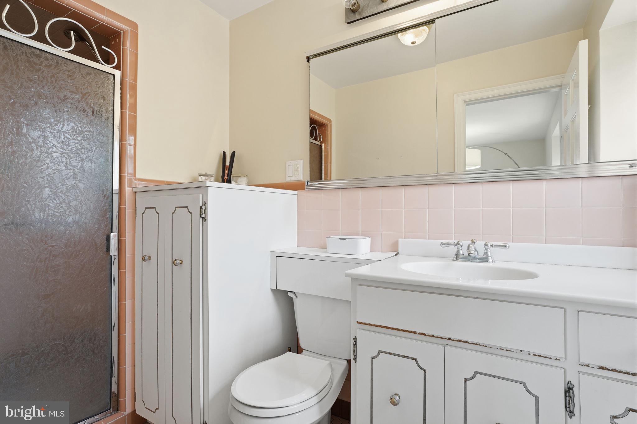 448 Moredon Road Huntingdon Valley, PA 19006 - Photo 20 of 66 a bathroom with a sink vanity mirror and toilet