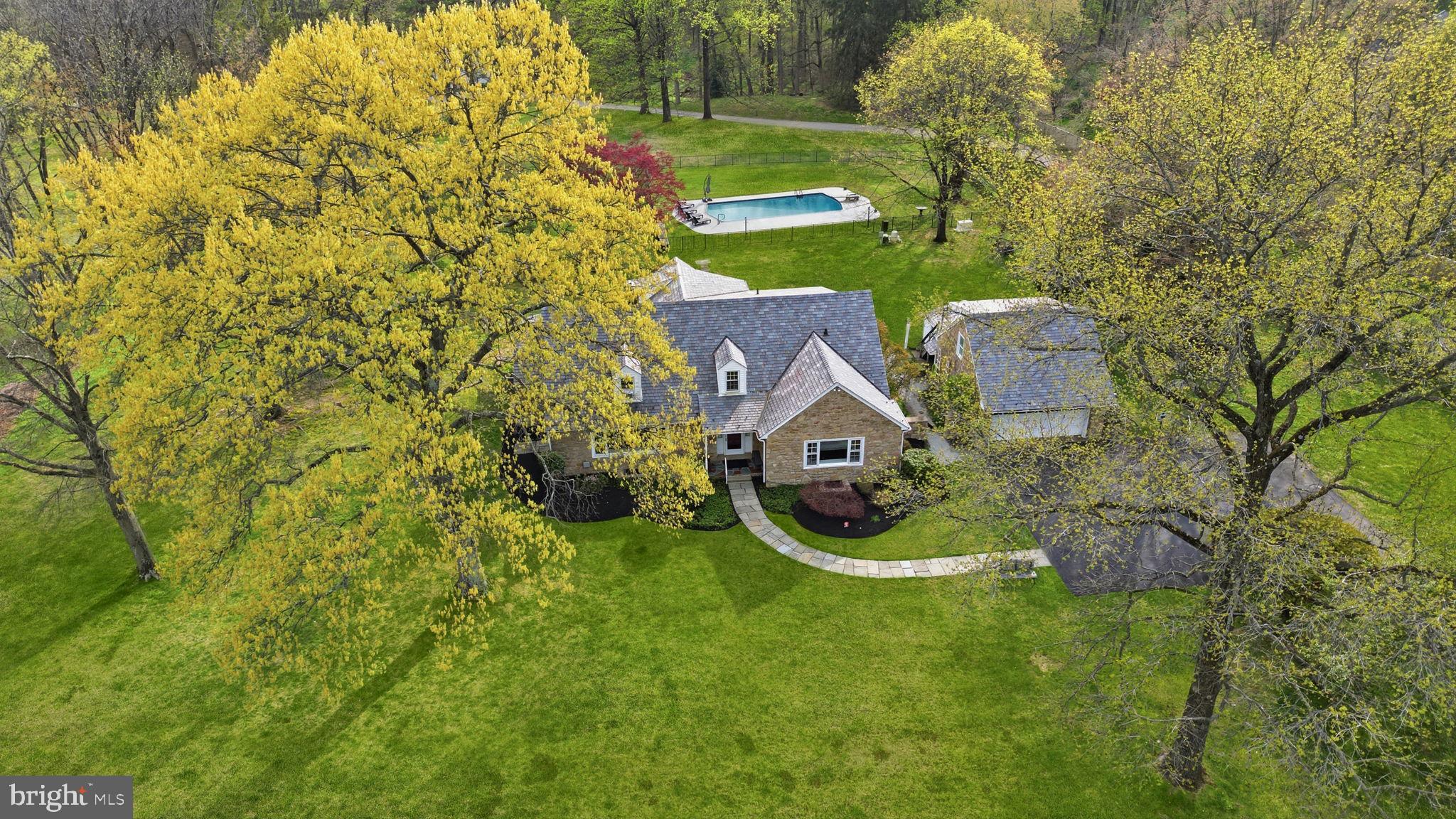 448 Moredon Road Huntingdon Valley, PA 19006 - Photo 2 of 66 view of a house with a big yard and large trees