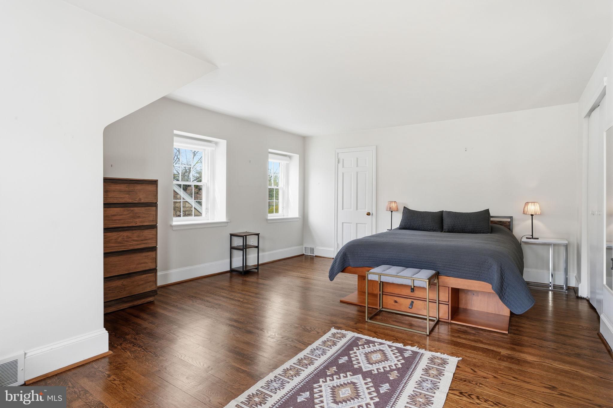 448 Moredon Road Huntingdon Valley, PA 19006 - Photo 33 of 66 a bedroom with a bed and wooden floor