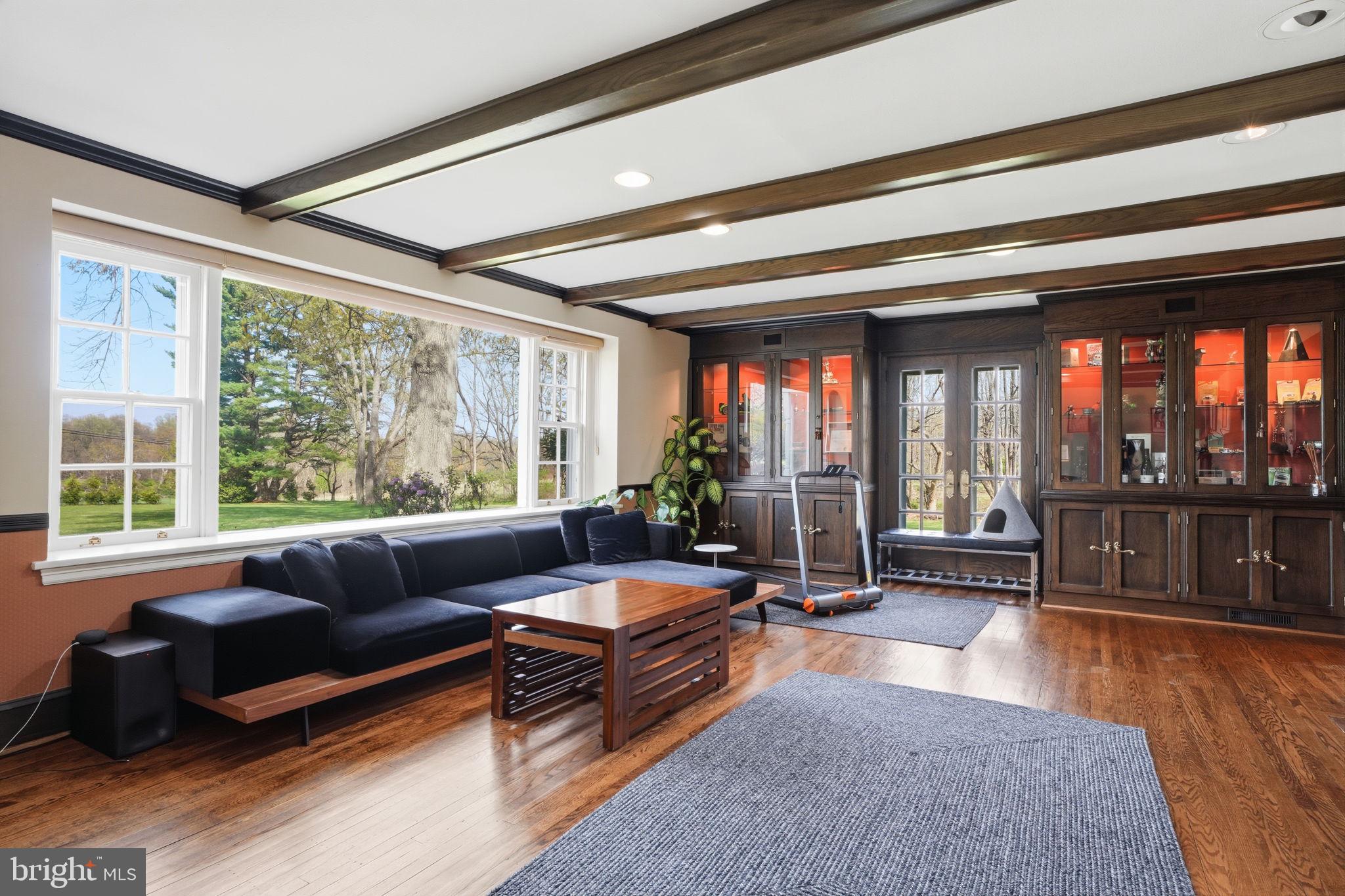 448 Moredon Road Huntingdon Valley, PA 19006 - Photo 41 of 66 a living room with furniture and floor to ceiling windows