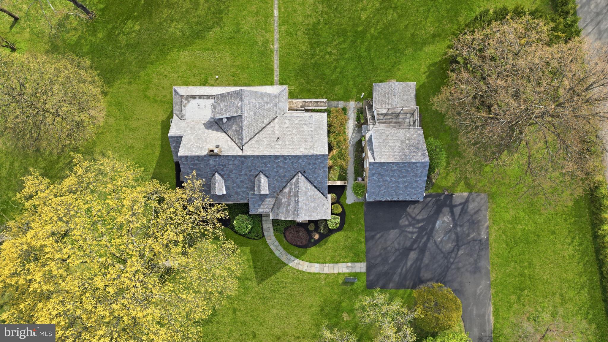 448 Moredon Road Huntingdon Valley, PA 19006 - Photo 48 of 66 an aerial view of a house with a garden and trees