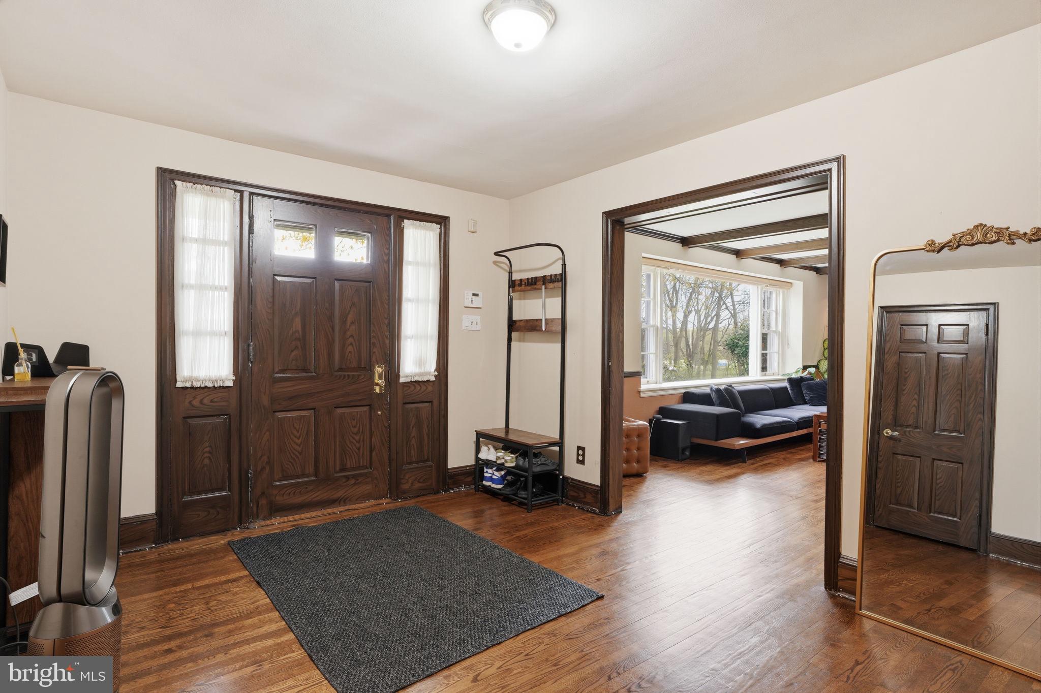 448 Moredon Road Huntingdon Valley, PA 19006 - Photo 6 of 66 a view of a livingroom with furniture and a flat screen tv