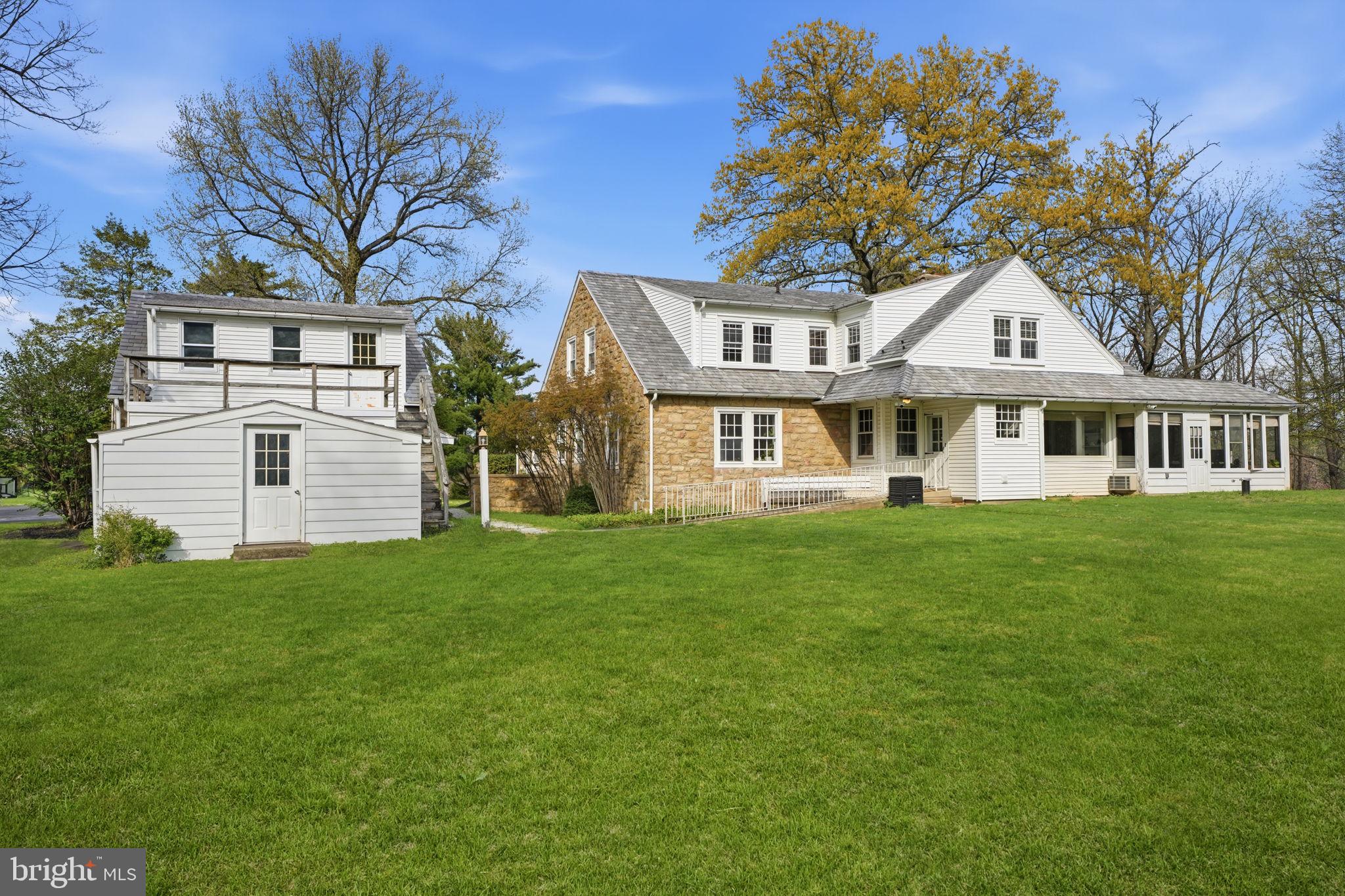 448 Moredon Road Huntingdon Valley, PA 19006 - Photo 64 of 66 a front view of a house with a garden