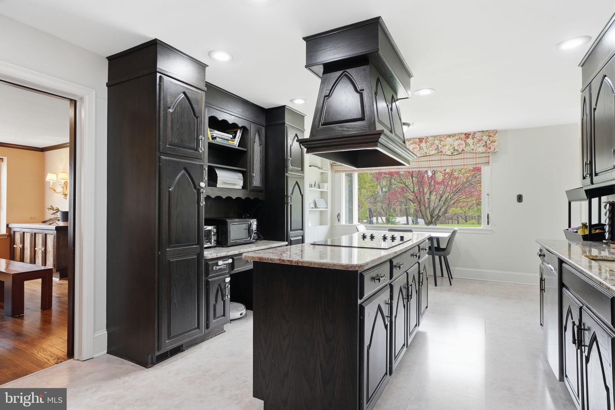 448 Moredon Road Huntingdon Valley, PA 19006 - Photo 10 of 66 a kitchen with stainless steel appliances granite countertop a sink a stove and a refrigerator