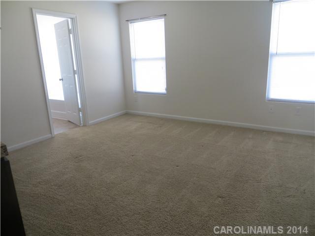 12017 Downy Birch Road Charlotte, NC 28227 - Photo 11 of 16 an empty room with windows