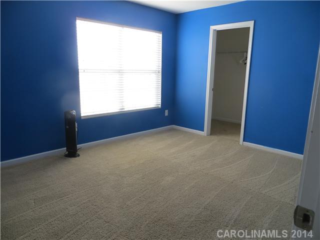 12017 Downy Birch Road Charlotte, NC 28227 - Photo 14 of 16 an empty room with windows