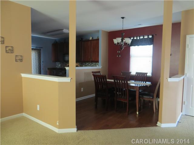 12017 Downy Birch Road Charlotte, NC 28227 - Photo 7 of 16 a view of a dining area with furniture