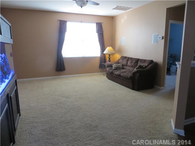 12017 Downy Birch Road Charlotte, NC 28227 - Photo 9 of 16 a living room with furniture and a window
