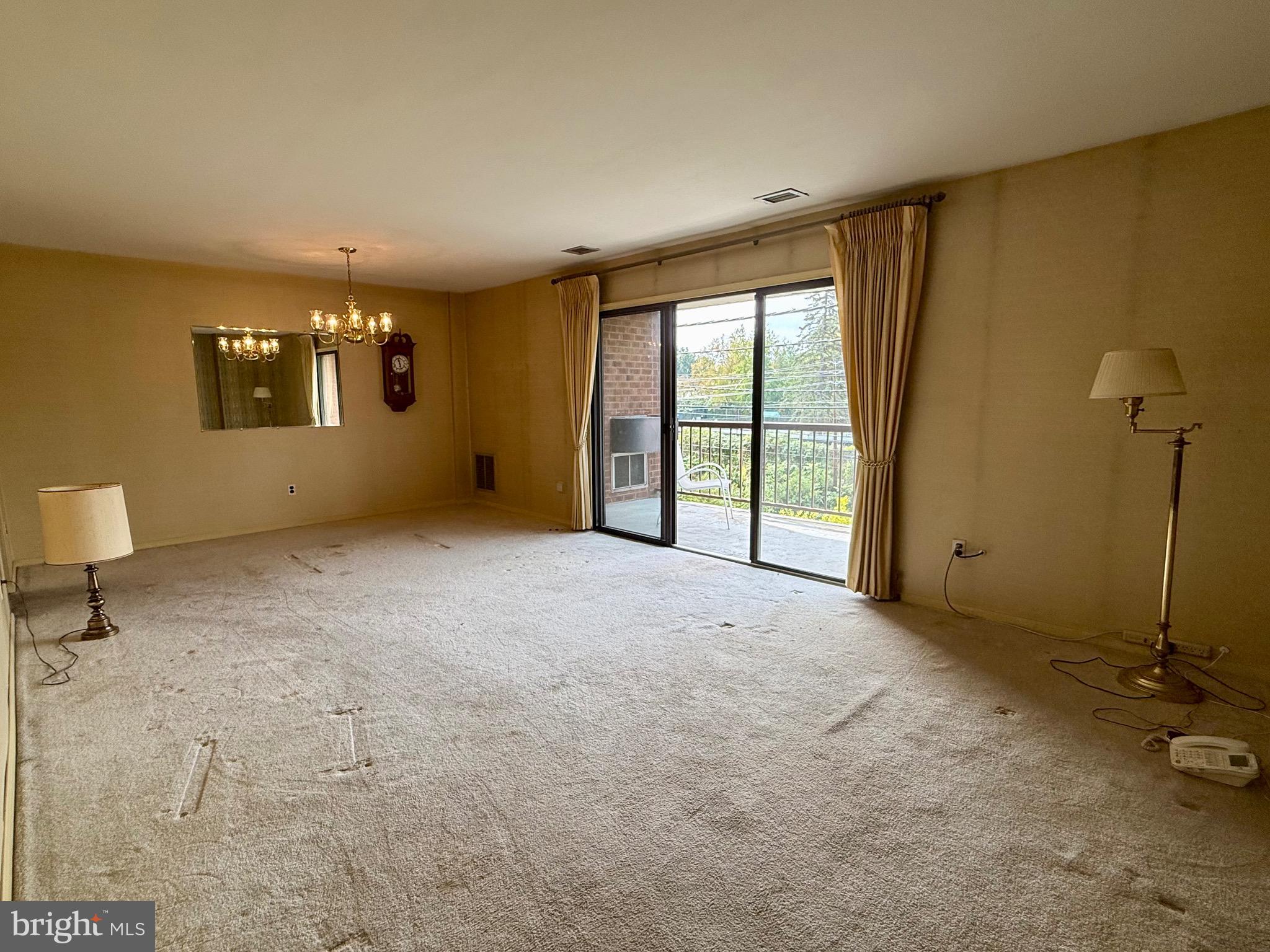 203 Haddonfield Commons Haddonfield, NJ 08033 - Photo 13 of 19 a view of an empty room with a window