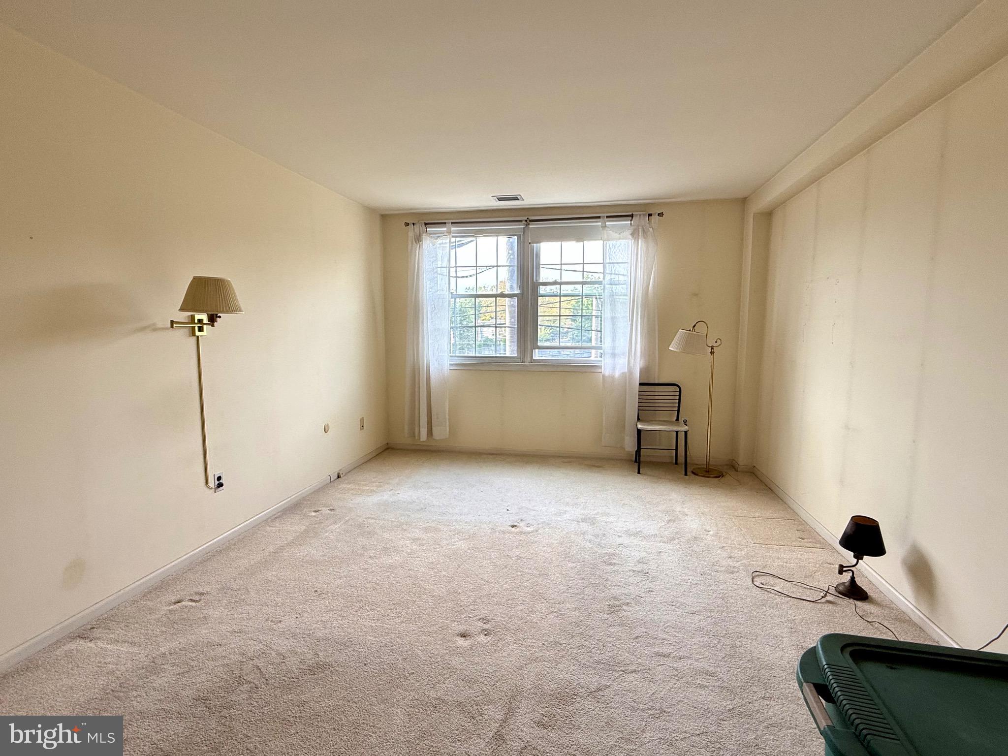 203 Haddonfield Commons Haddonfield, NJ 08033 - Photo 16 of 19 a view of an empty room with a window
