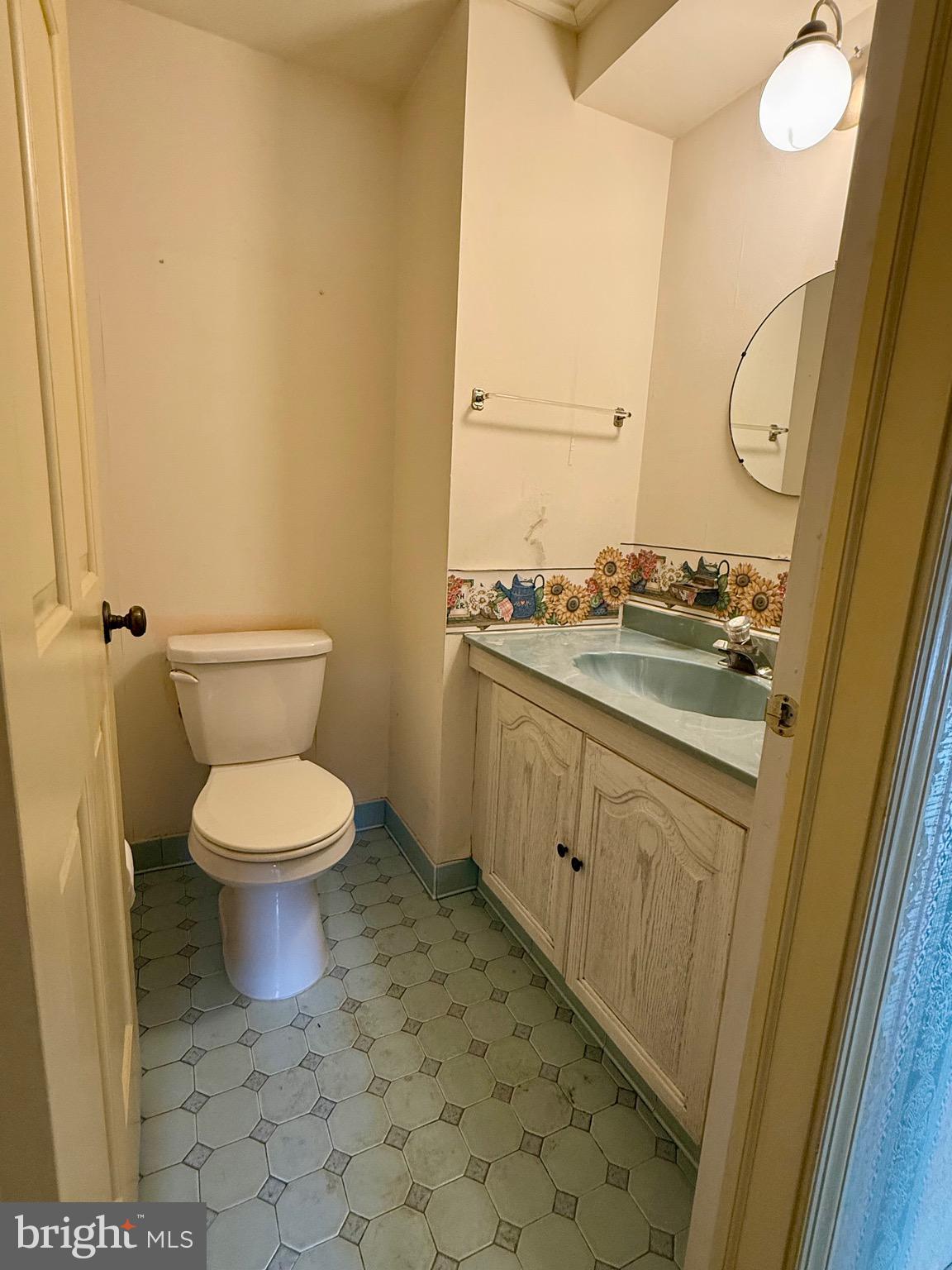 203 Haddonfield Commons Haddonfield, NJ 08033 - Photo 18 of 19 a bathroom with a granite countertop toilet and a sink