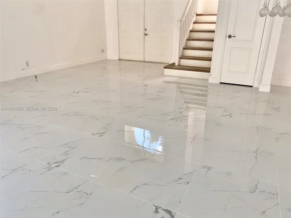 a view of a hallway with stairs