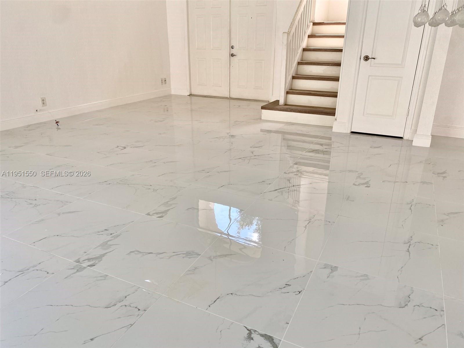 11301 Rockinghorse Road Cooper City, FL 33026 - Photo 6 of 34 a view of a hallway with stairs