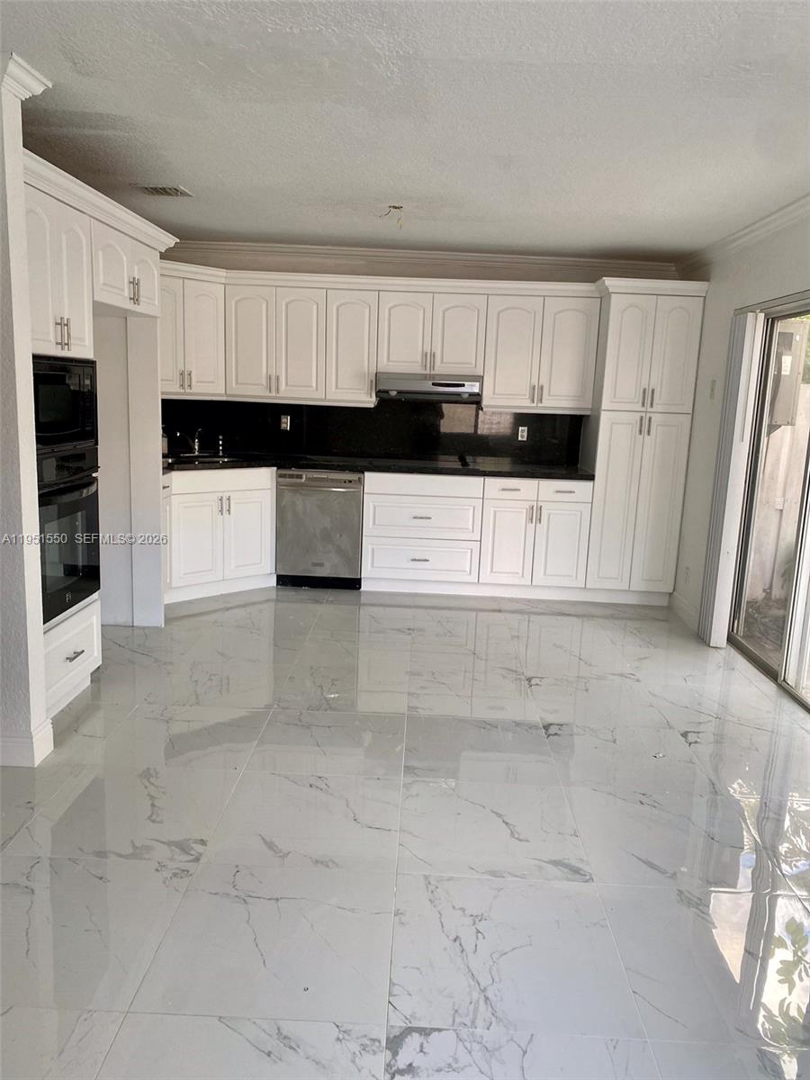 11301 Rockinghorse Road Cooper City, FL 33026 - Photo 9 of 34 a view of kitchen with white cabinets