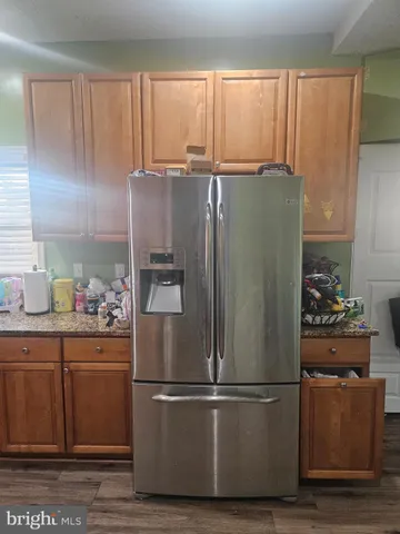 a white refrigerator freezer sitting in a kitchen