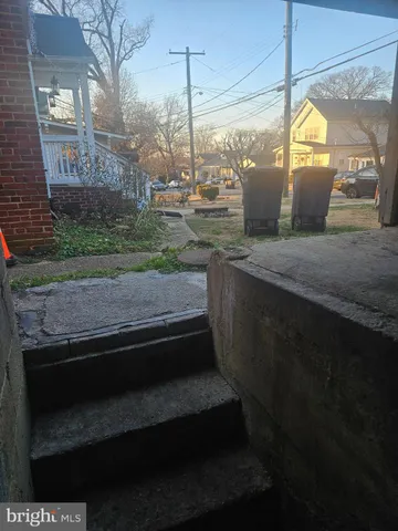 a kitchen with a sink and a wooden floor