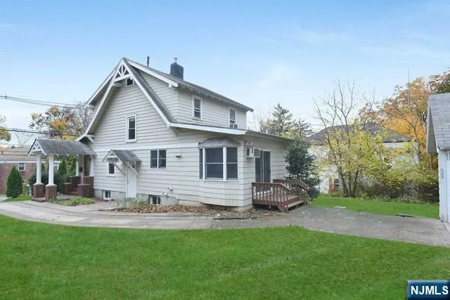 a front view of house with yard and outdoor seating
