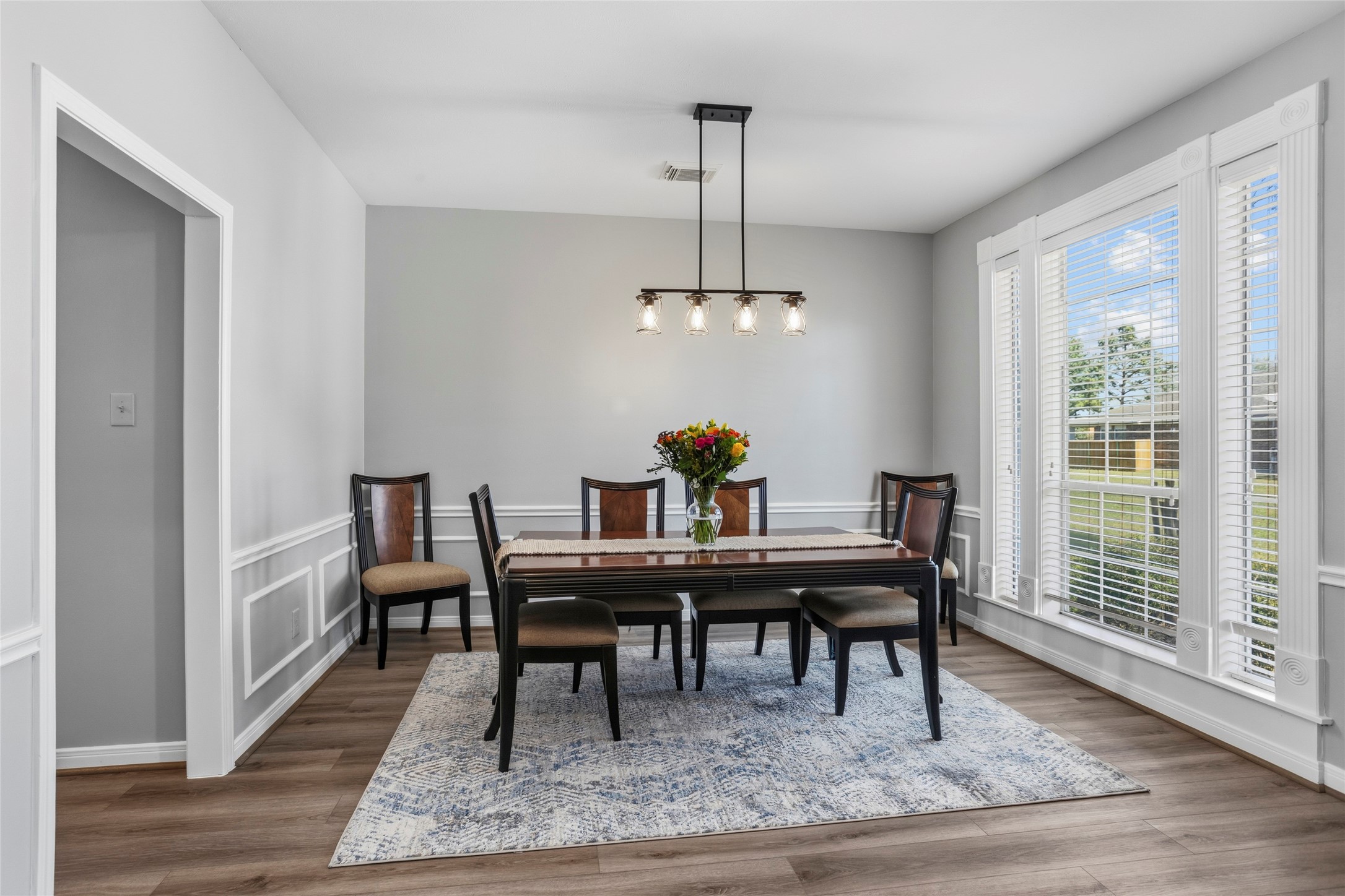 1131 Windsor Chase Lane Spring, TX 77373 - Photo 12 of 39 a view of a dining room with furniture window and wooden floor