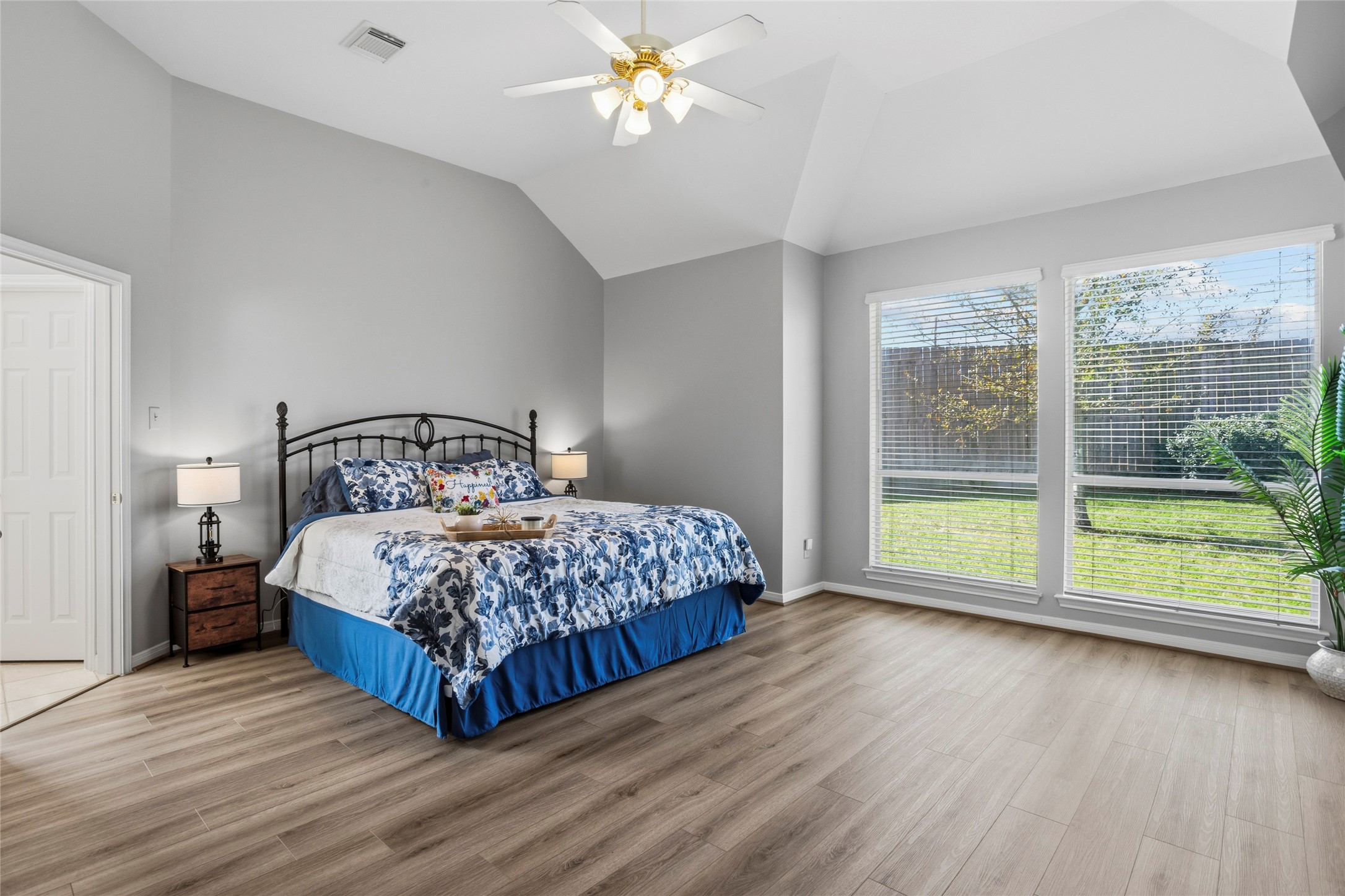 1131 Windsor Chase Lane Spring, TX 77373 - Photo 13 of 39 a bedroom with a large bed and a large window