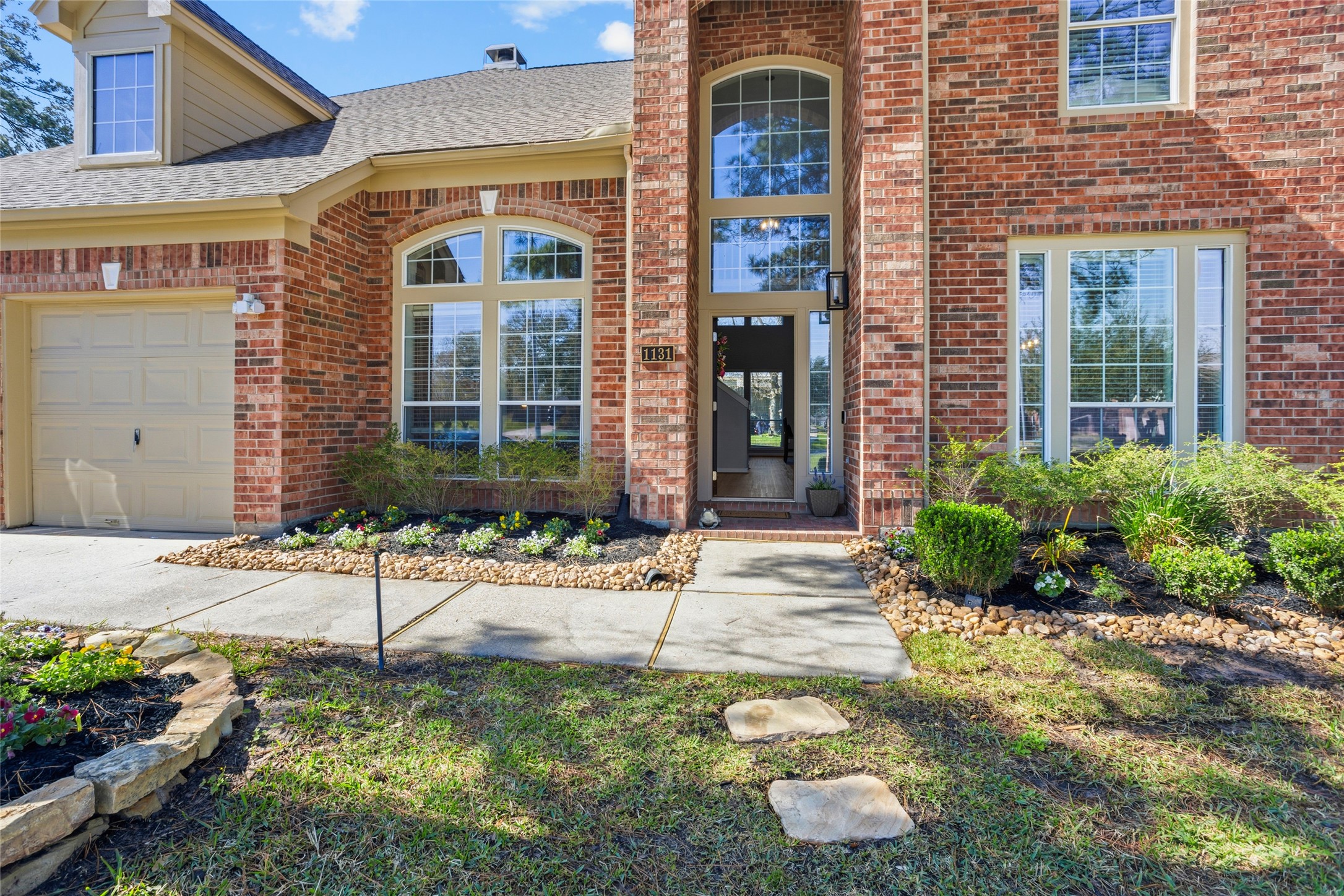 1131 Windsor Chase Lane Spring, TX 77373 - Photo 2 of 39 a front view of a house with a yard