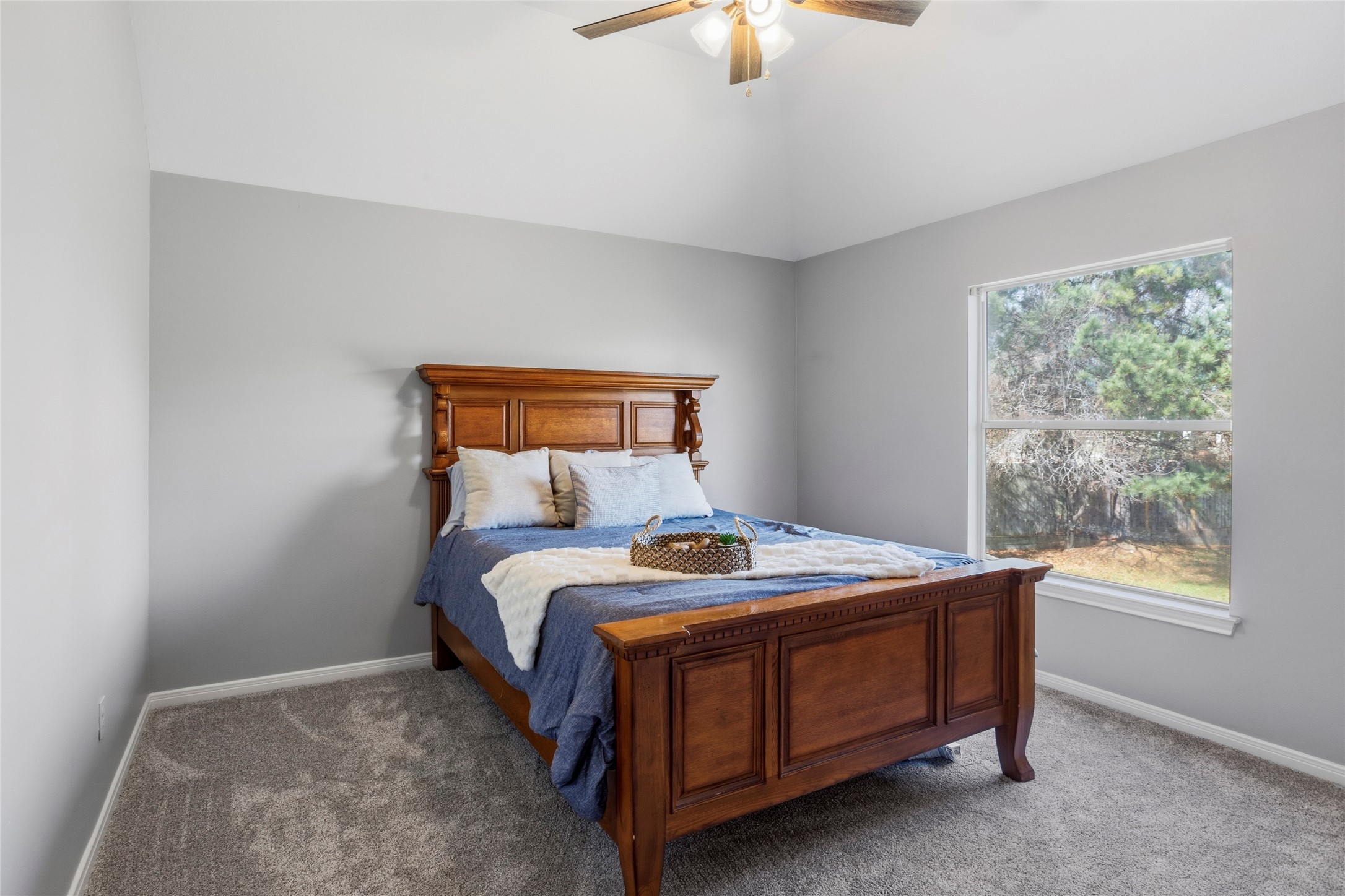 1131 Windsor Chase Lane Spring, TX 77373 - Photo 30 of 39 a bed sitting in a bedroom next to a window