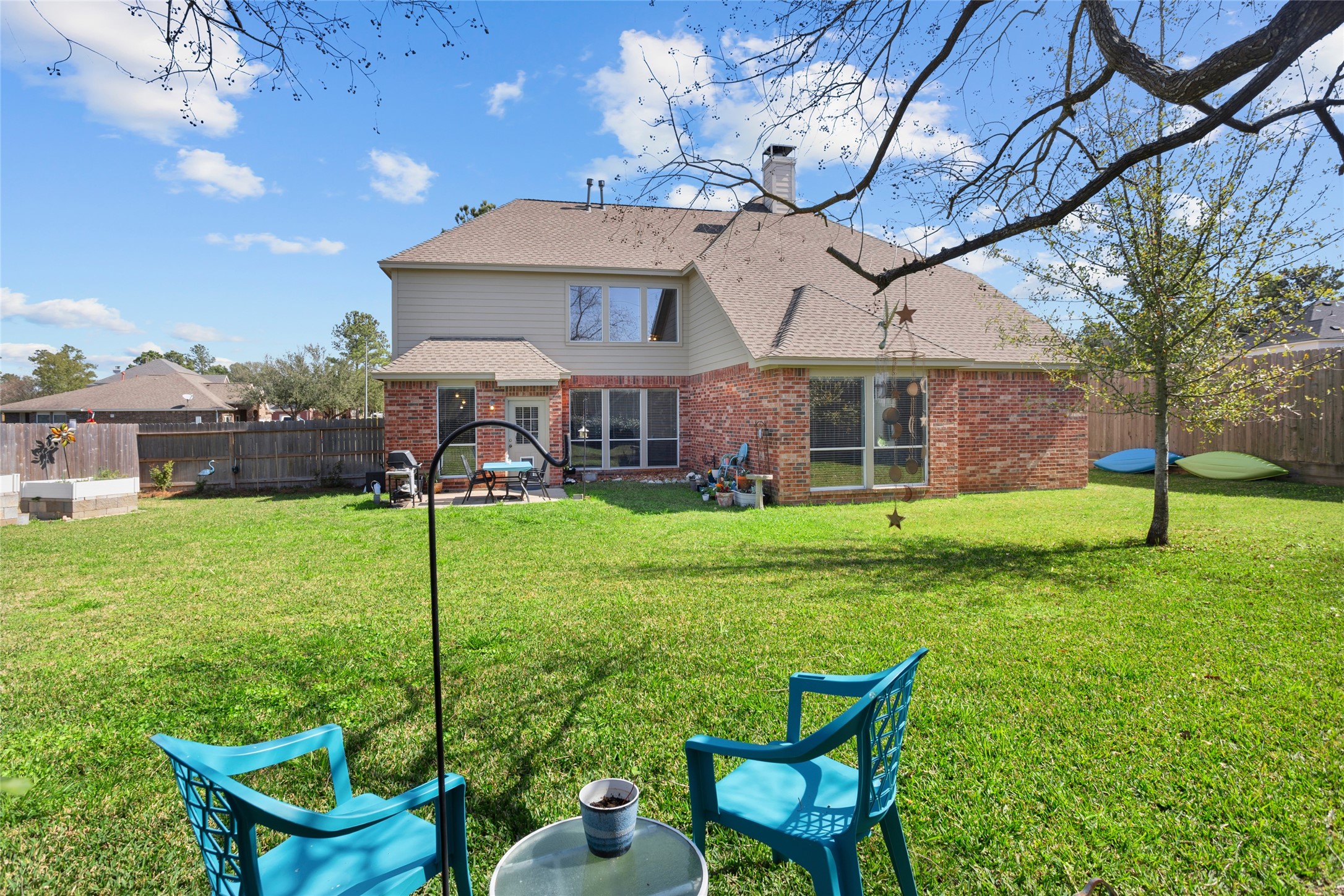 1131 Windsor Chase Lane Spring, TX 77373 - Photo 34 of 39 a view of a house with a backyard