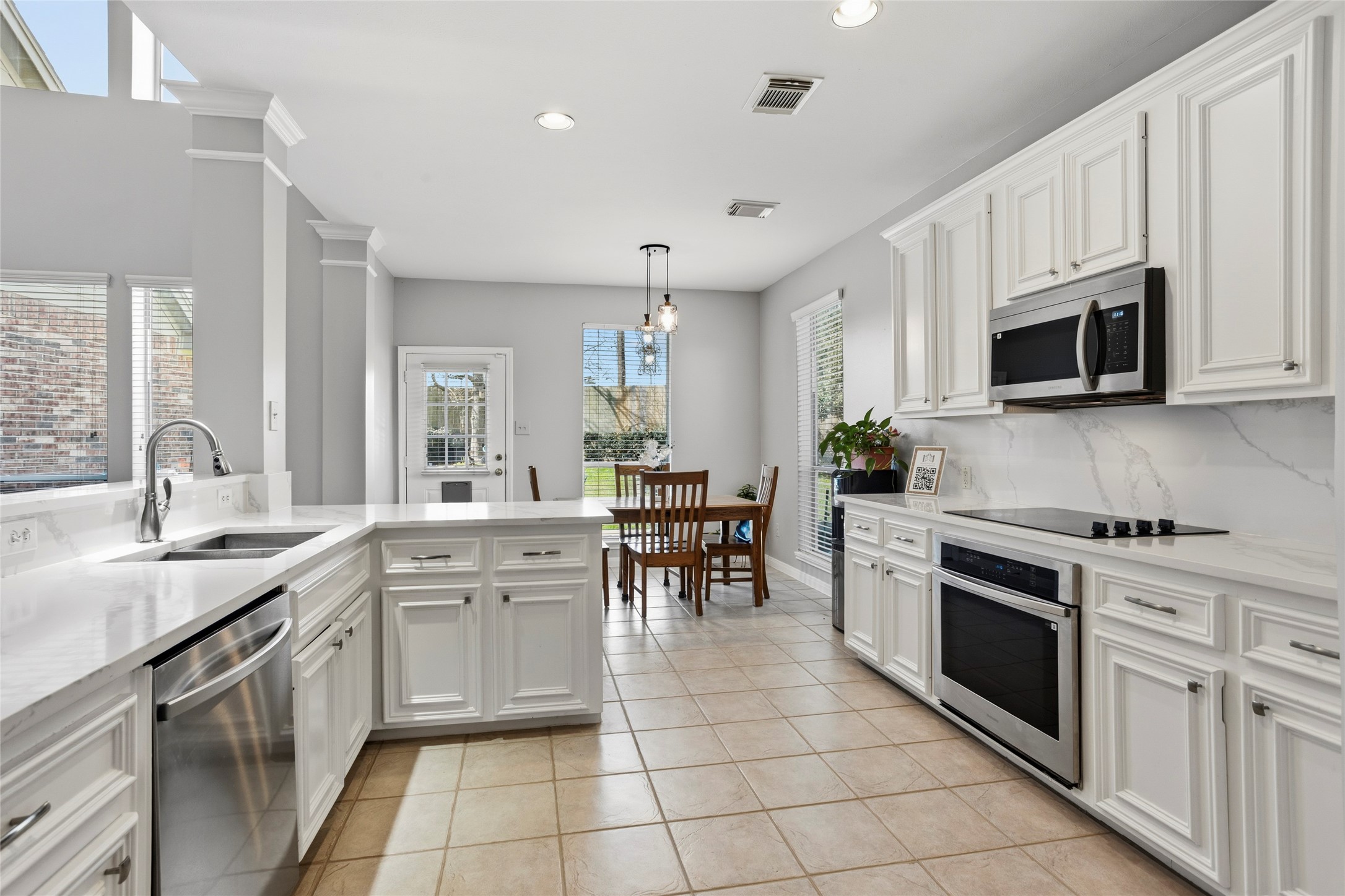 1131 Windsor Chase Lane Spring, TX 77373 - Photo 9 of 39 a kitchen with appliances cabinets and furniture