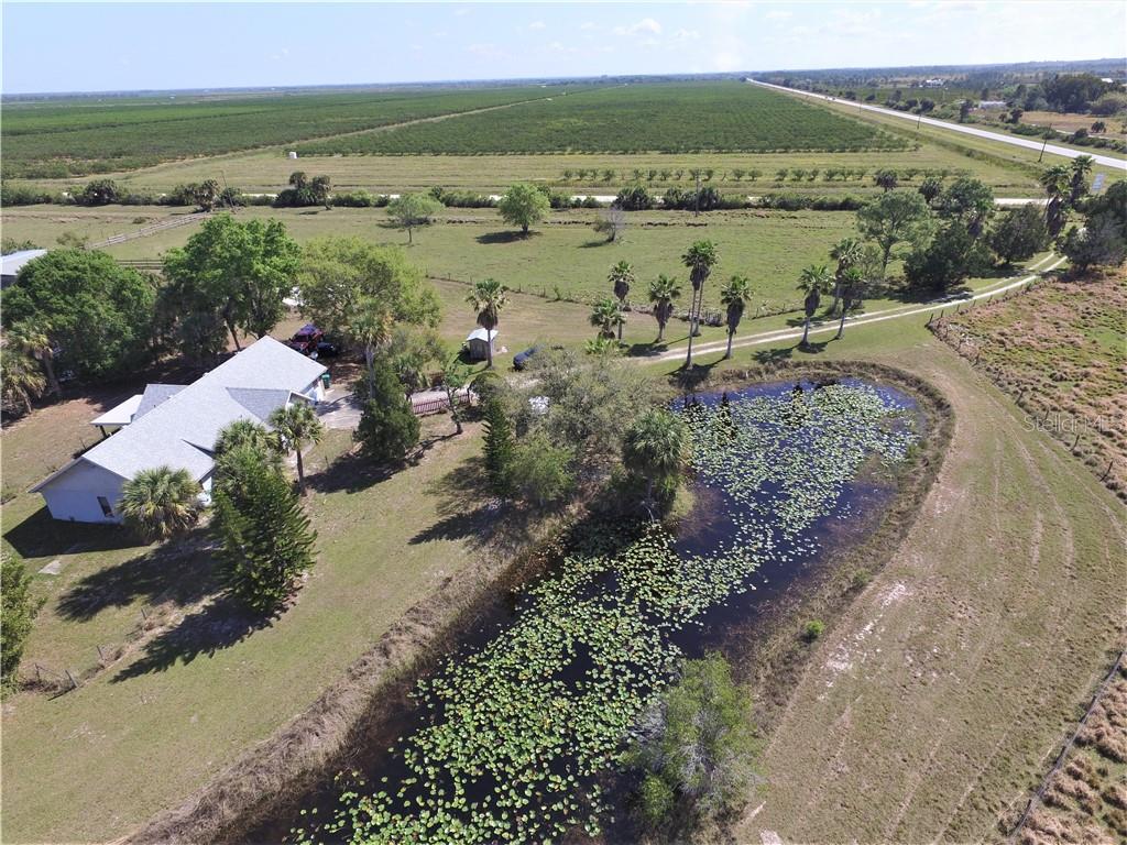 47990 Bermont Road Punta Gorda, FL 33982 - Photo 1 of 1 Aerial View with pond facing East