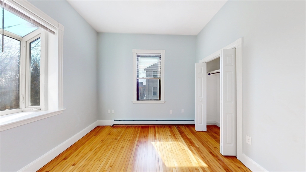 181 Highland Street, Unit 1 Boston, MA 02119 - Photo 9 of 11 a view of a room with wooden floor and pool