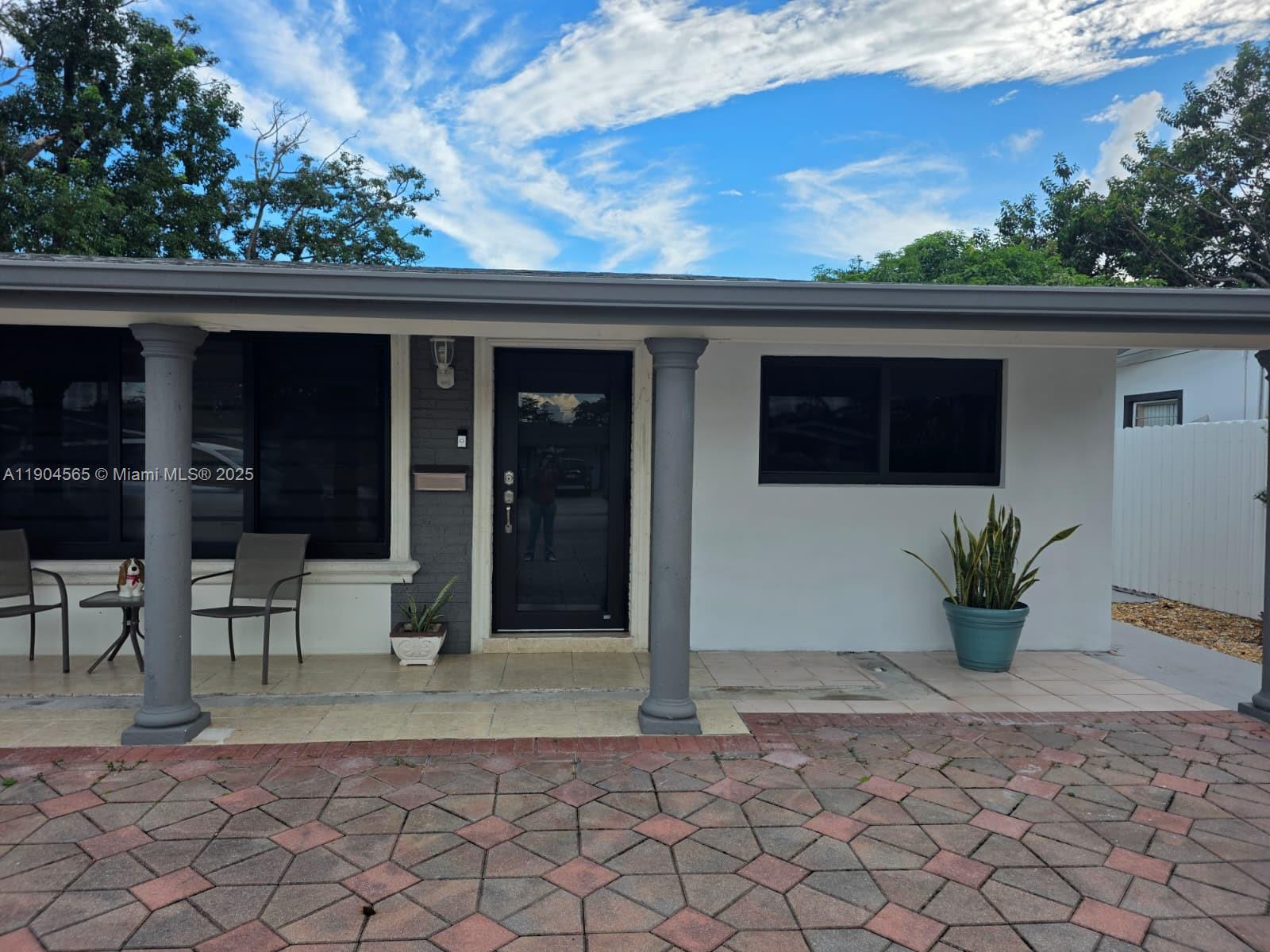 a view of porch with a bench