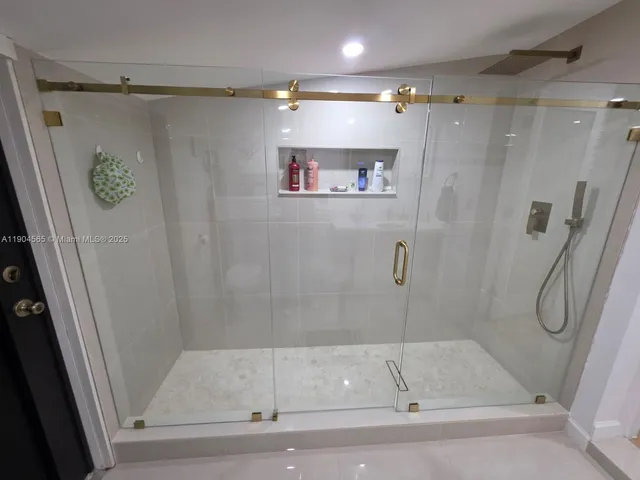 a bedroom with a bed and lamp