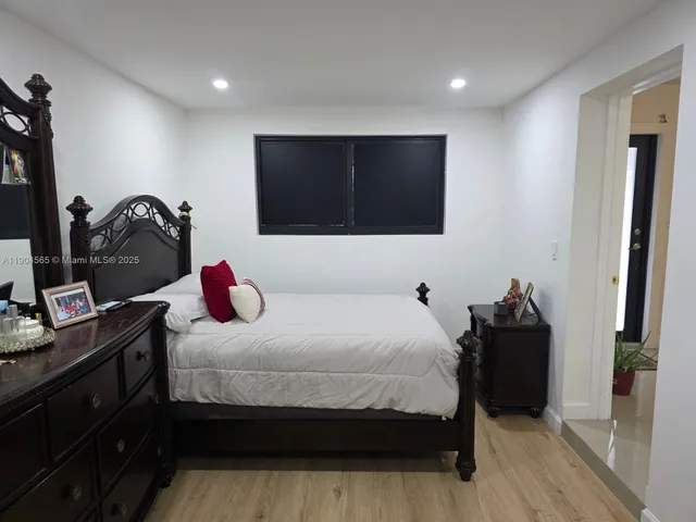 a bathroom with a sink mirror and a shower
