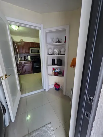 a view of house with backyard space and sitting area