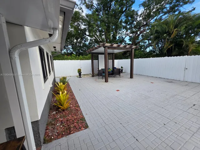 a backyard of a house with lots of green space