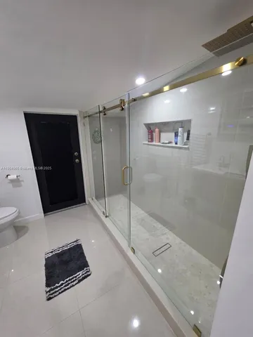 a very nice looking room with a big bed and a flat screen tv