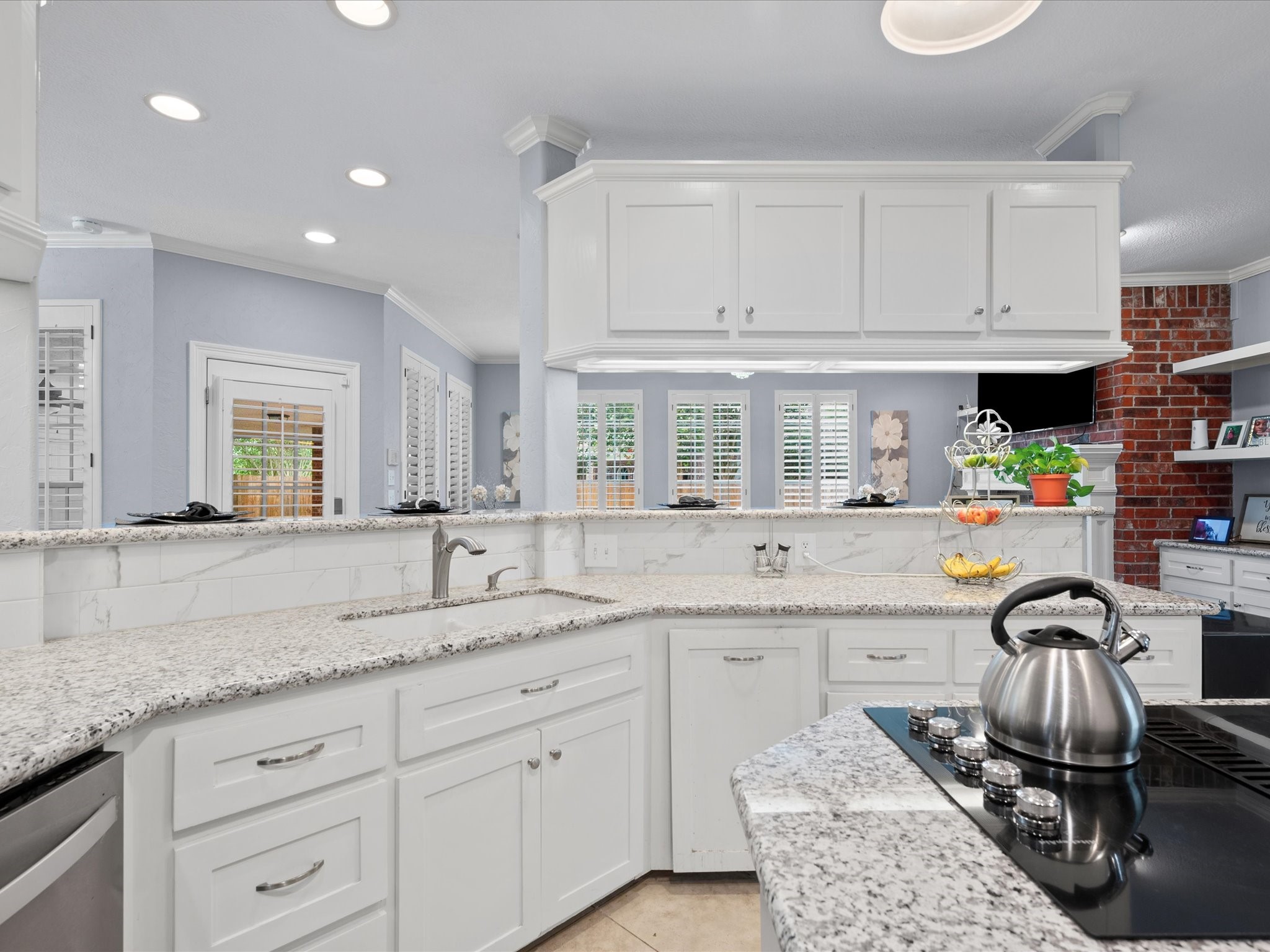 16123 Lafone Drive Spring, TX 77379 - Photo 14 of 47 Open to the adjoining living area, the kitchen is filled with natural light and designed to bring people together, making everyday living and entertaining effortless.