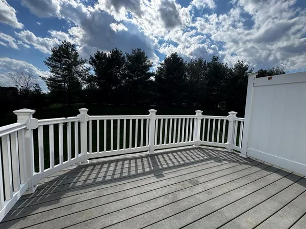 a view of deck with wooden floor and fence
