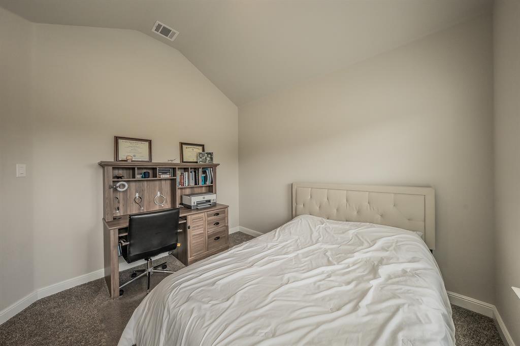 1212 Bosque Lane Weatherford, TX 76087 - Photo 22 of 38 a bedroom with a bed and a desk