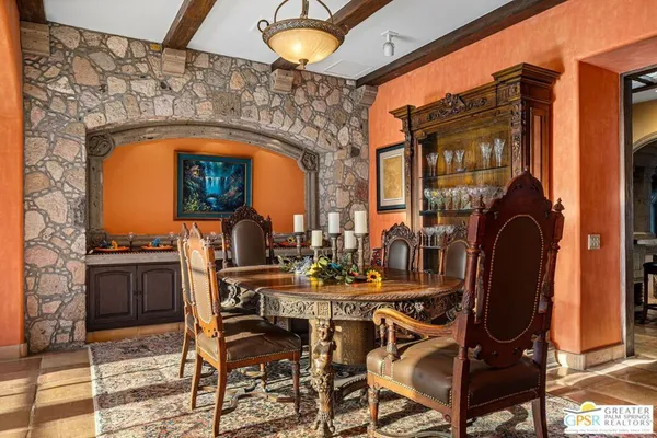 a living room with furniture fireplace and a large window