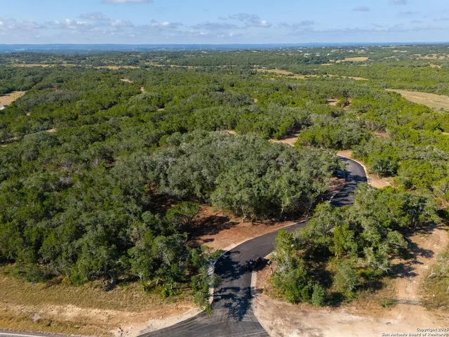 an aerial view of residential house with outdoor space