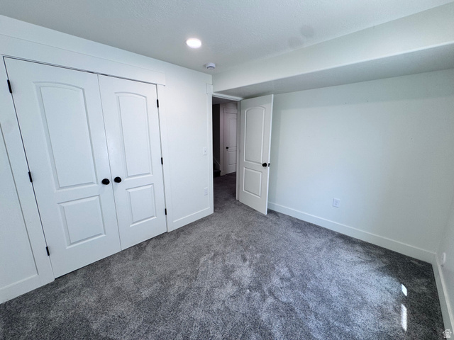 4729 Middleboro Road Herriman, UT 84096 - Photo 12 of 19 Carpeted room with white walls, recessed ceiling lighting, and crisp white trim