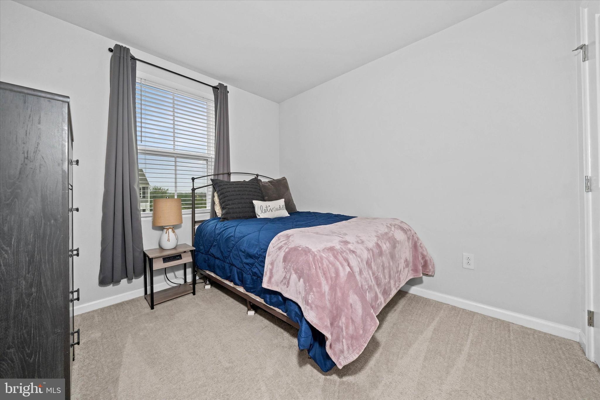 309 Mingo Way Townsend, DE 19734 - Photo 24 of 34 a bedroom with a bed and window