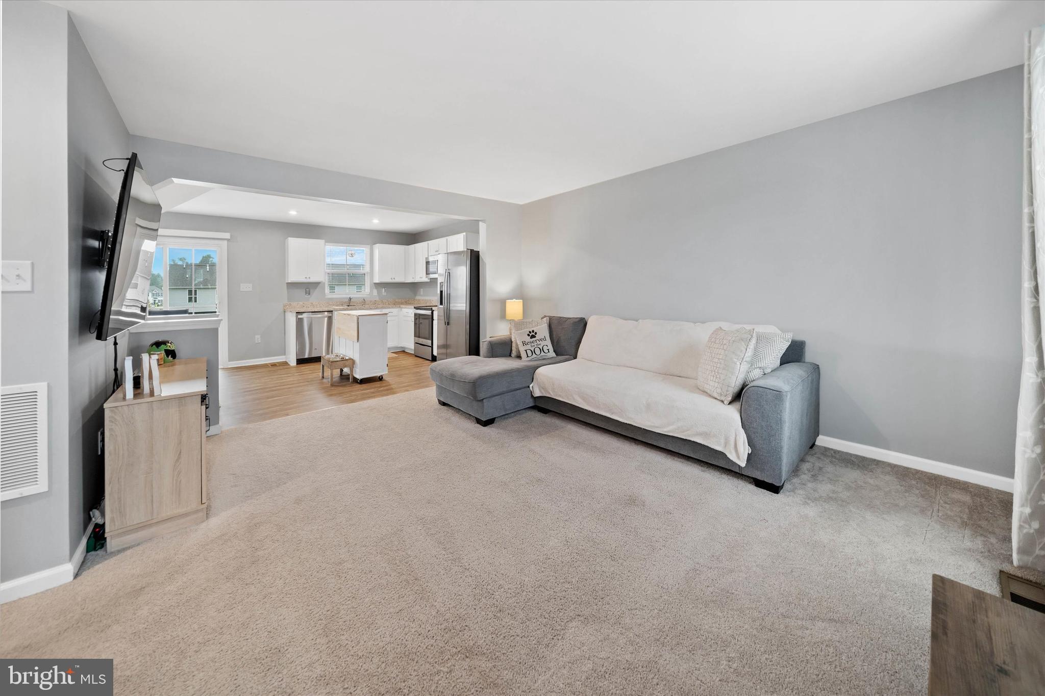 309 Mingo Way Townsend, DE 19734 - Photo 8 of 34 a living room with furniture and a flat screen tv