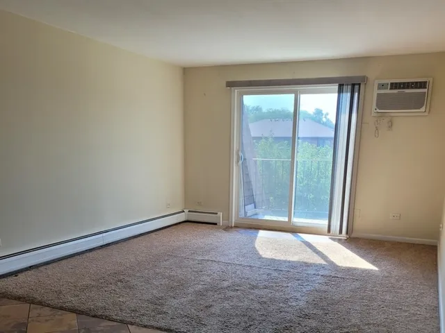 an empty room with large window